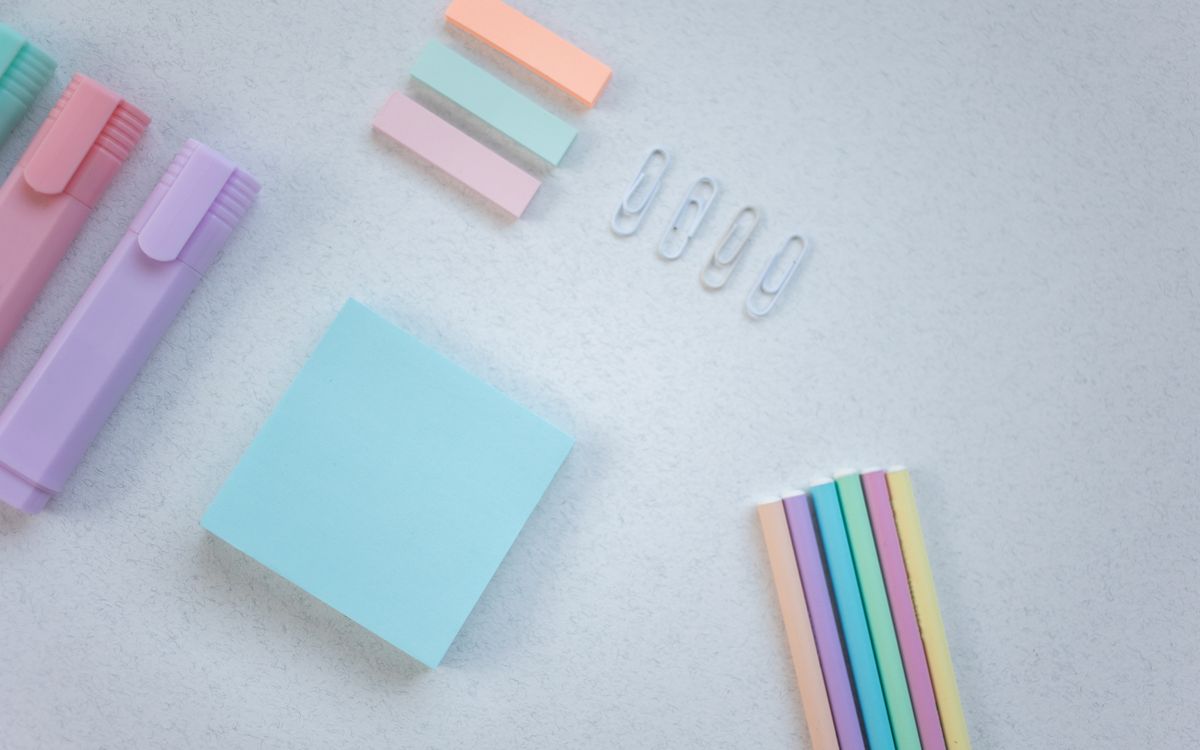 Creative pastel stationery set on white background, ideal for education themes.