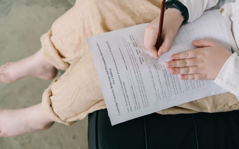 Young child completing a questionnaire indoors for educational purposes.